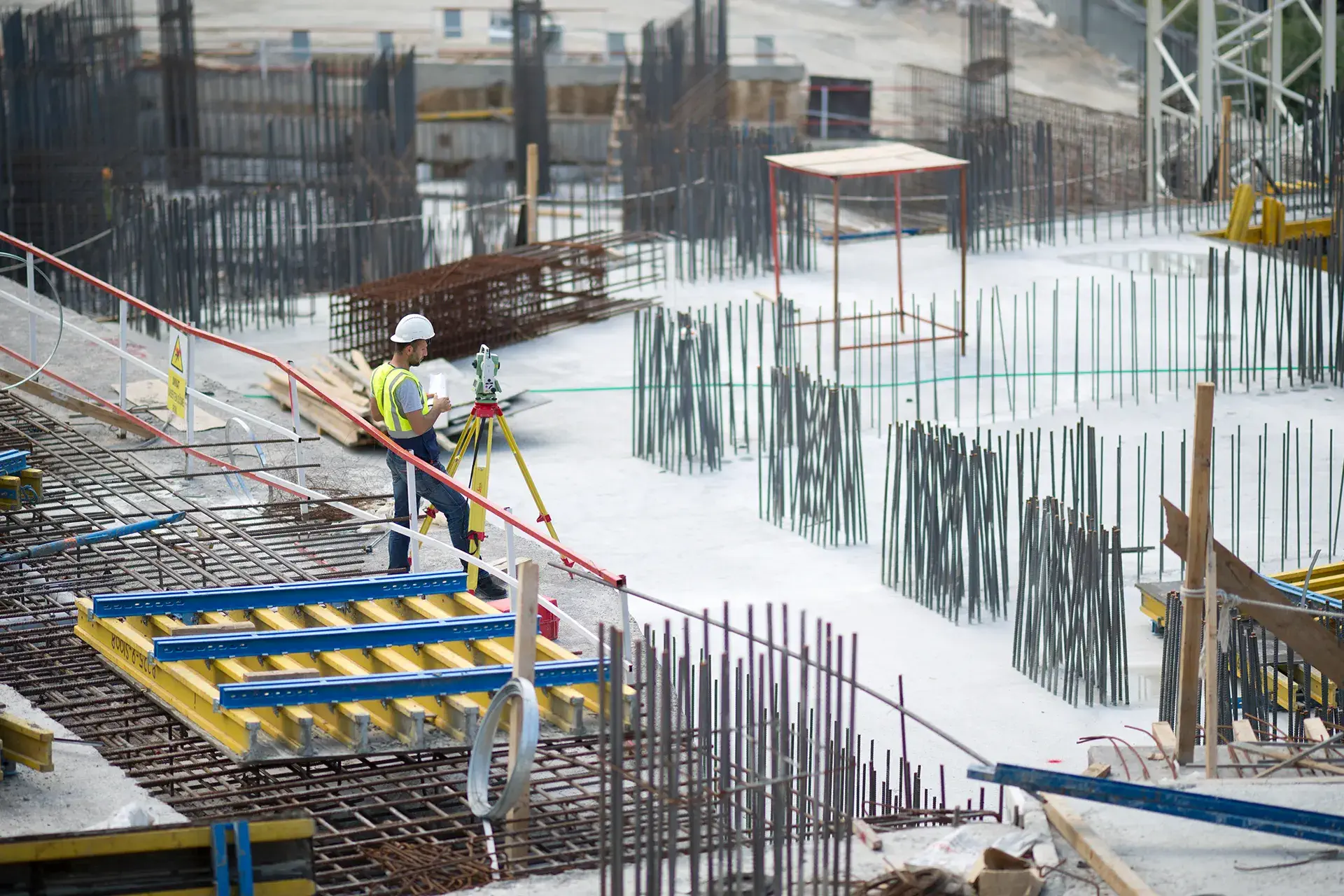 A large construction project where the worker is standing on the building in Long Island, NY