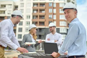 Construction professionals and researchers exploring technology solutions on a modern jobsite.