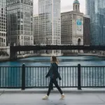 A woman walking along the Chicago river