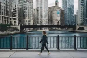 A woman walking along the Chicago river